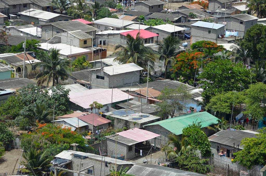 An aerial view of Palmar, Ecuador with colorful roofs visible