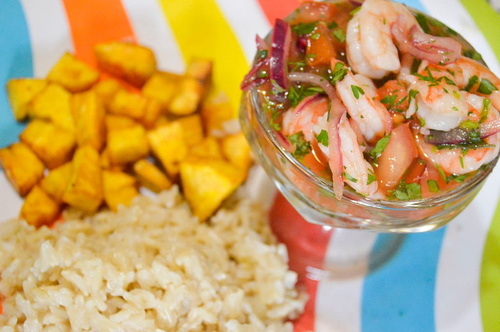 Shrimp ceviche on a colorfully striped plate