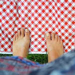 Feet on top of a checkered cloth