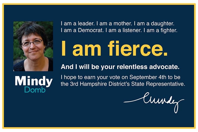 A postcard image with a portrait of Mindy Domb and the words, "I am fierce" in bold yellow text